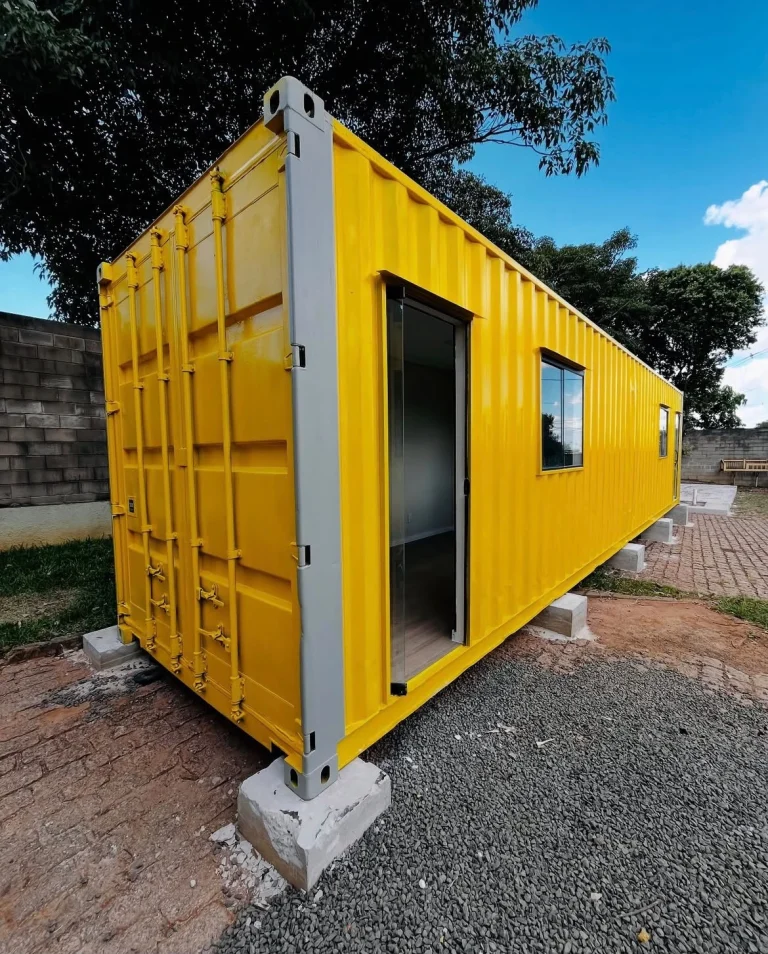 Shipping container set level on concrete block foundation pads on a gravel site